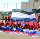 На центральной площади с. Большеустьикинское в День Государственного флага Российской Федерации прошла молодежная акция "Гордо реет флаг России",  